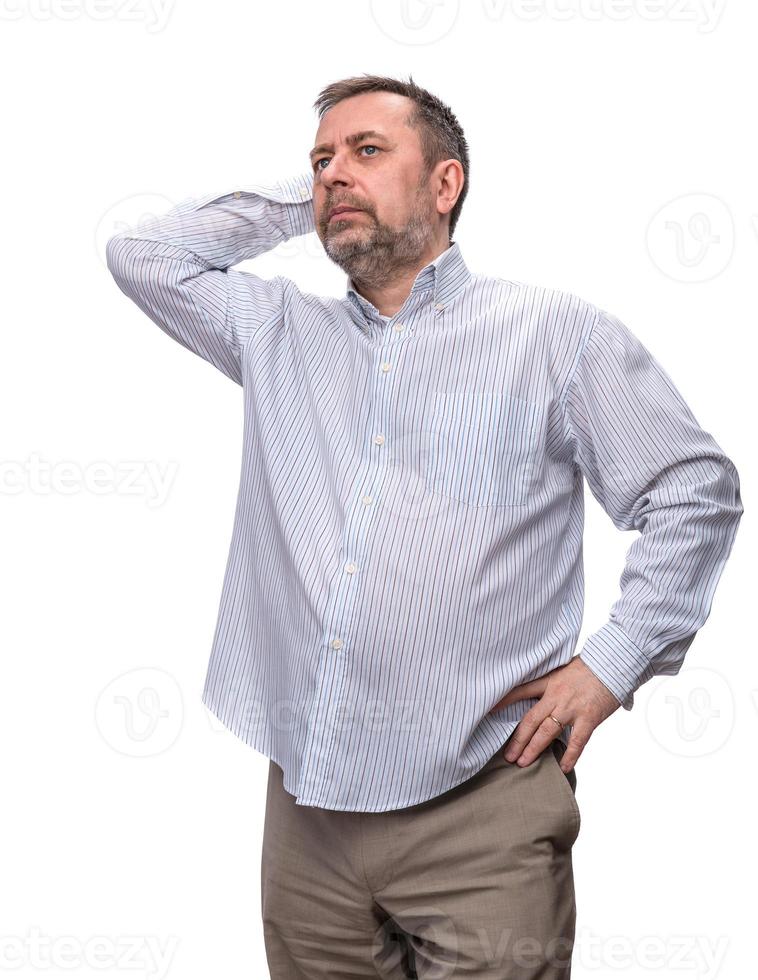 Handsome positive middle-aged business man standing and thinking photo