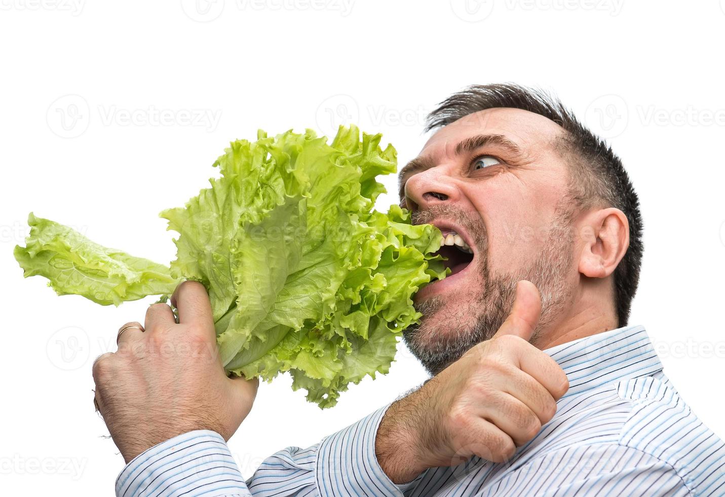 A man with a bundle of lettuce for healthy eating photo