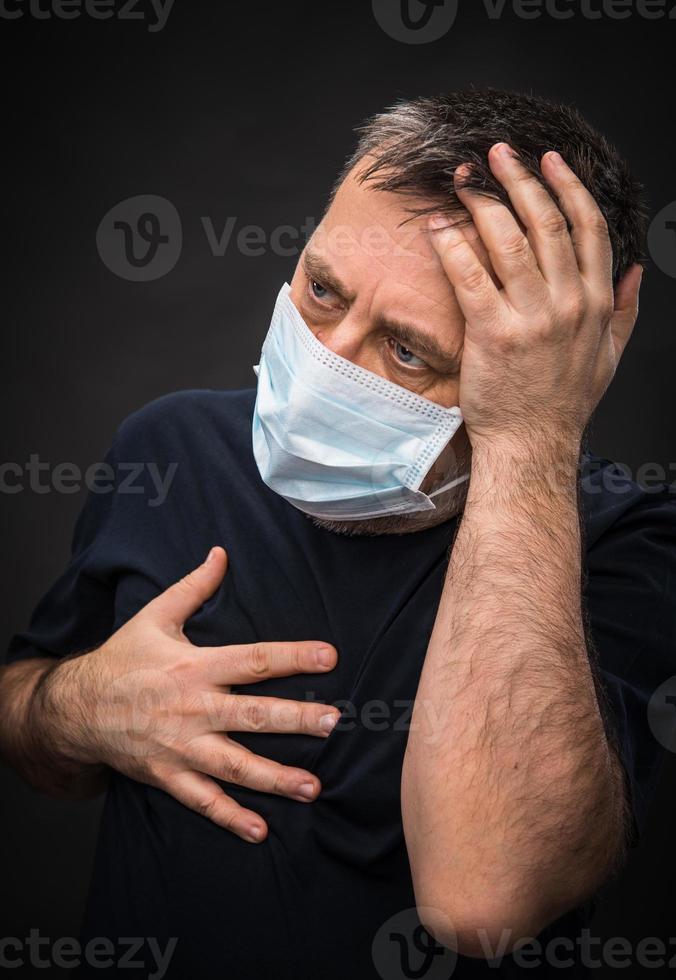 sick old man in medical mask photo