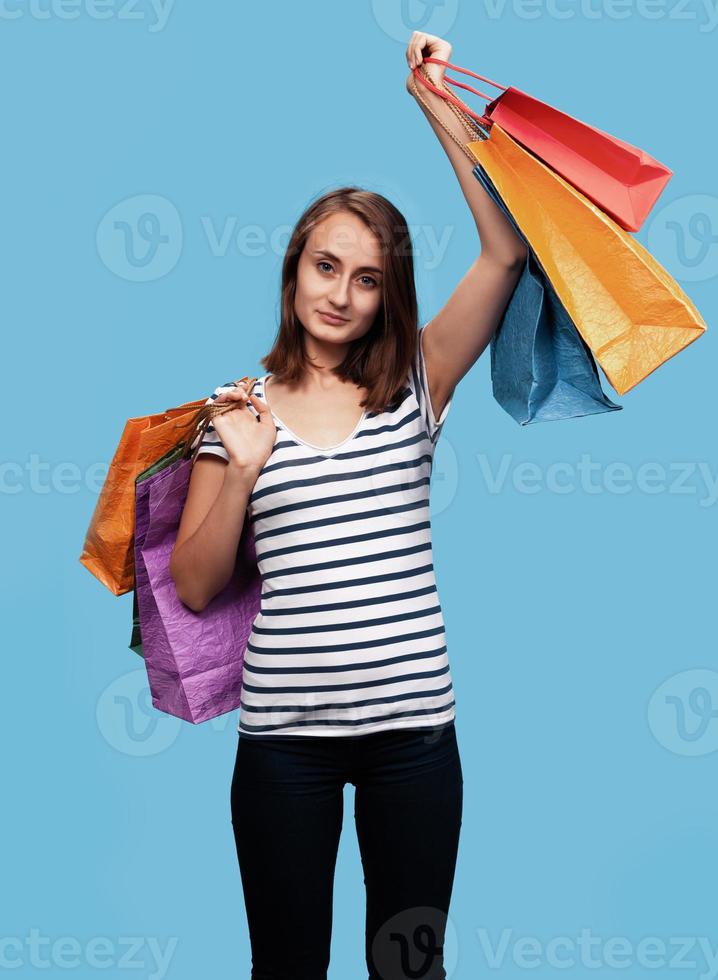 Happy young woman with shopping bags photo