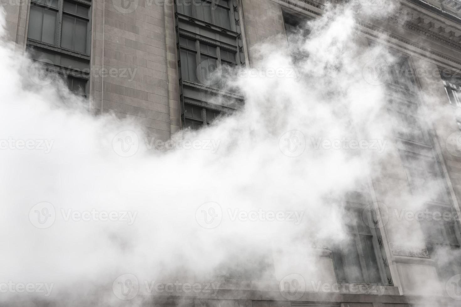 Vapor from street underground in NYC photo