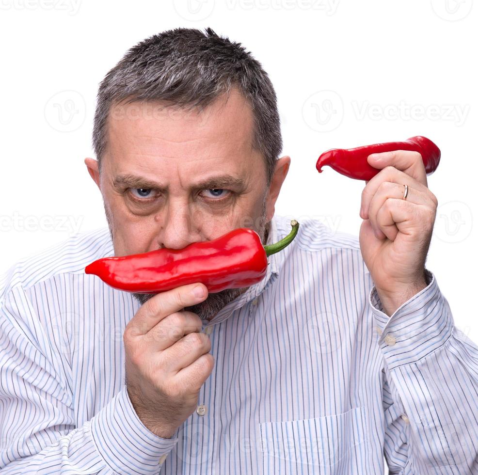 A man with a red pepper 18730063 Stock Photo at Vecteezy