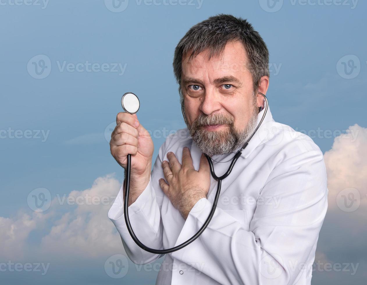 Mad doctor with a stethoscope photo