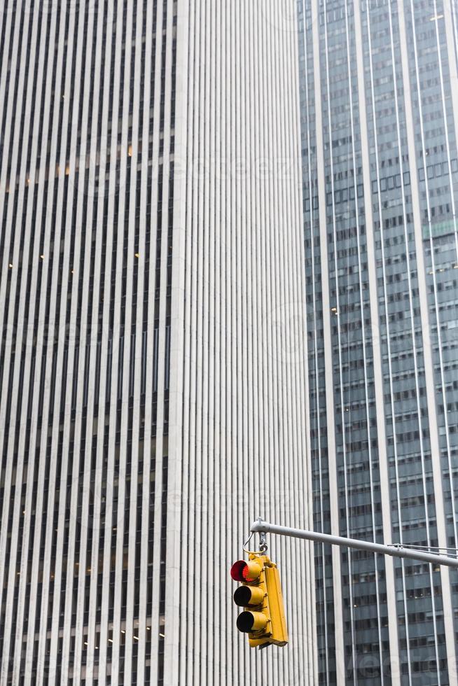 Yellow traffic light with a red signal stop photo