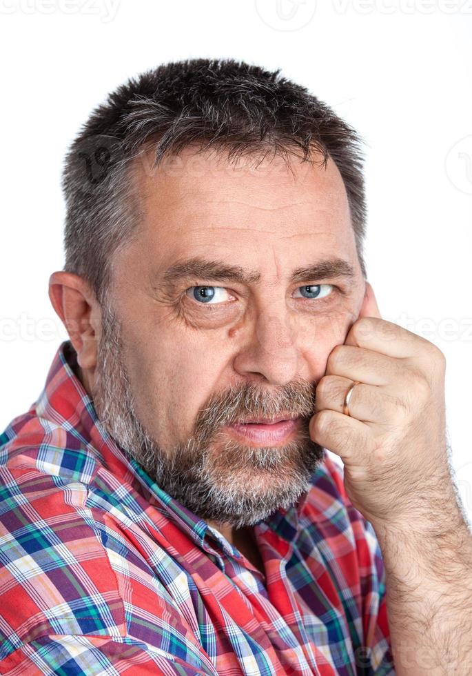 Thoughtful middle age man with hand near the face photo