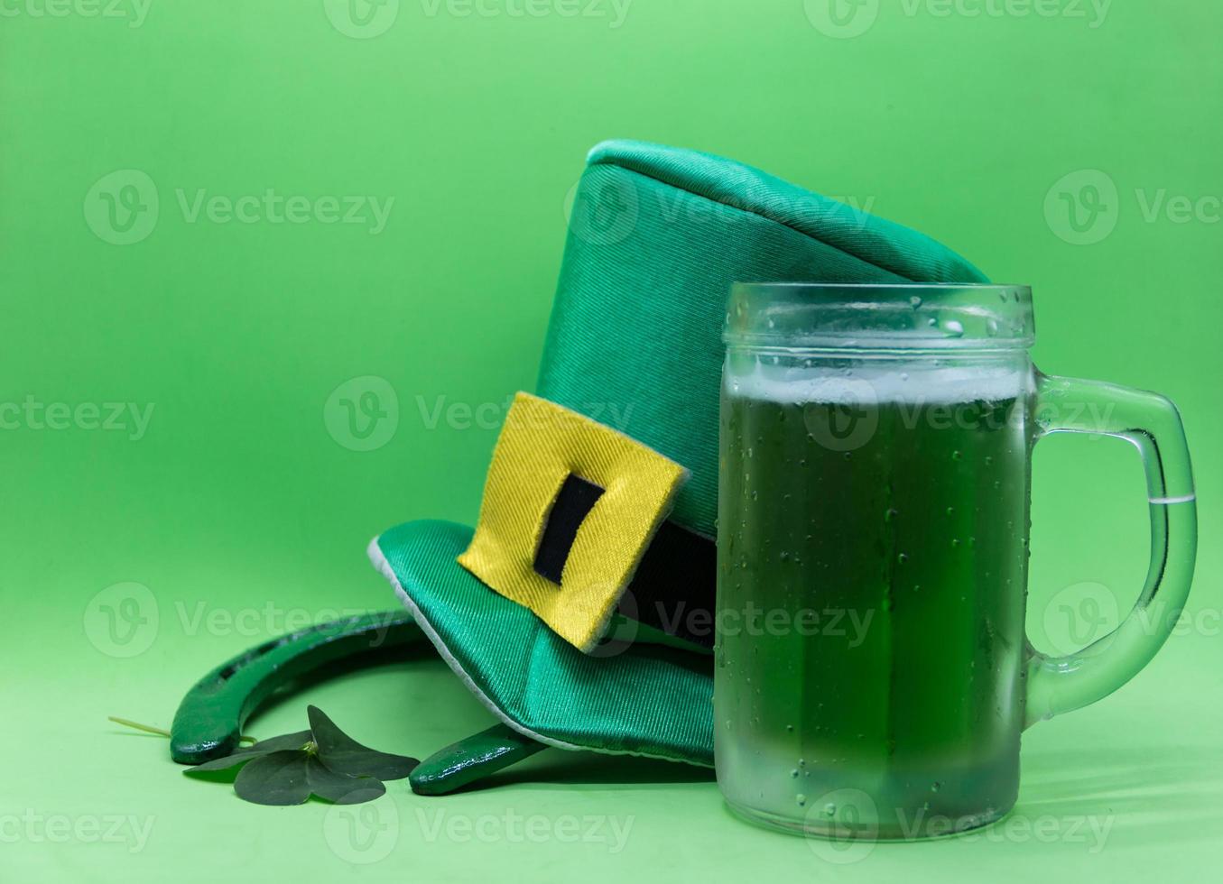 saint patrick's day symbols on green background photo