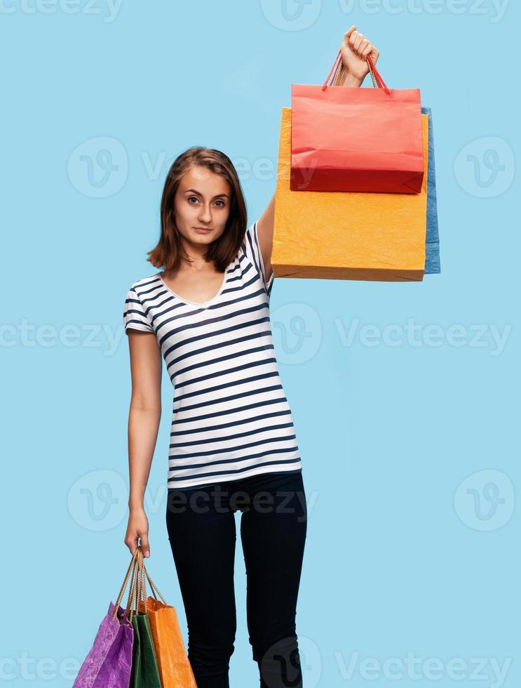 Happy young woman with shopping bags photo