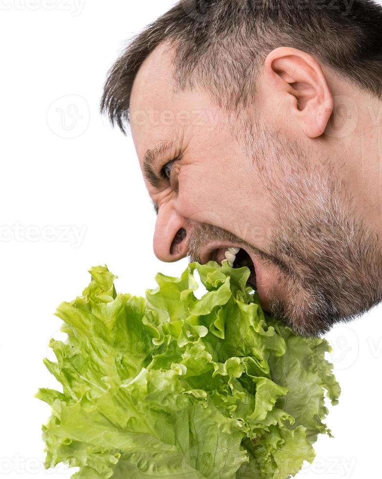 A man with a bundle of lettuce for healthy eating photo
