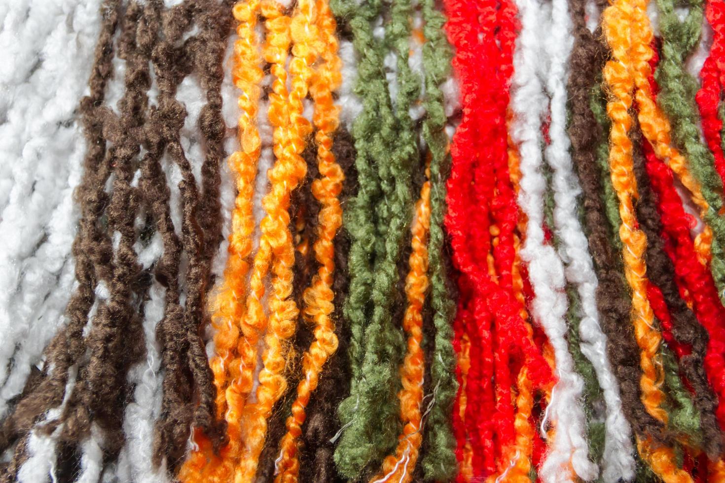 texture of wool fringes and colored threads photo
