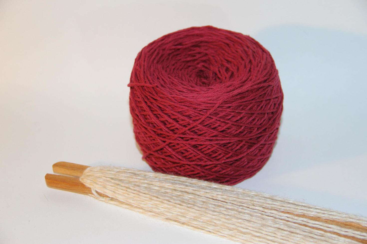 looms, loom fittings, woven scarves, colored yarns white backgrounds photo