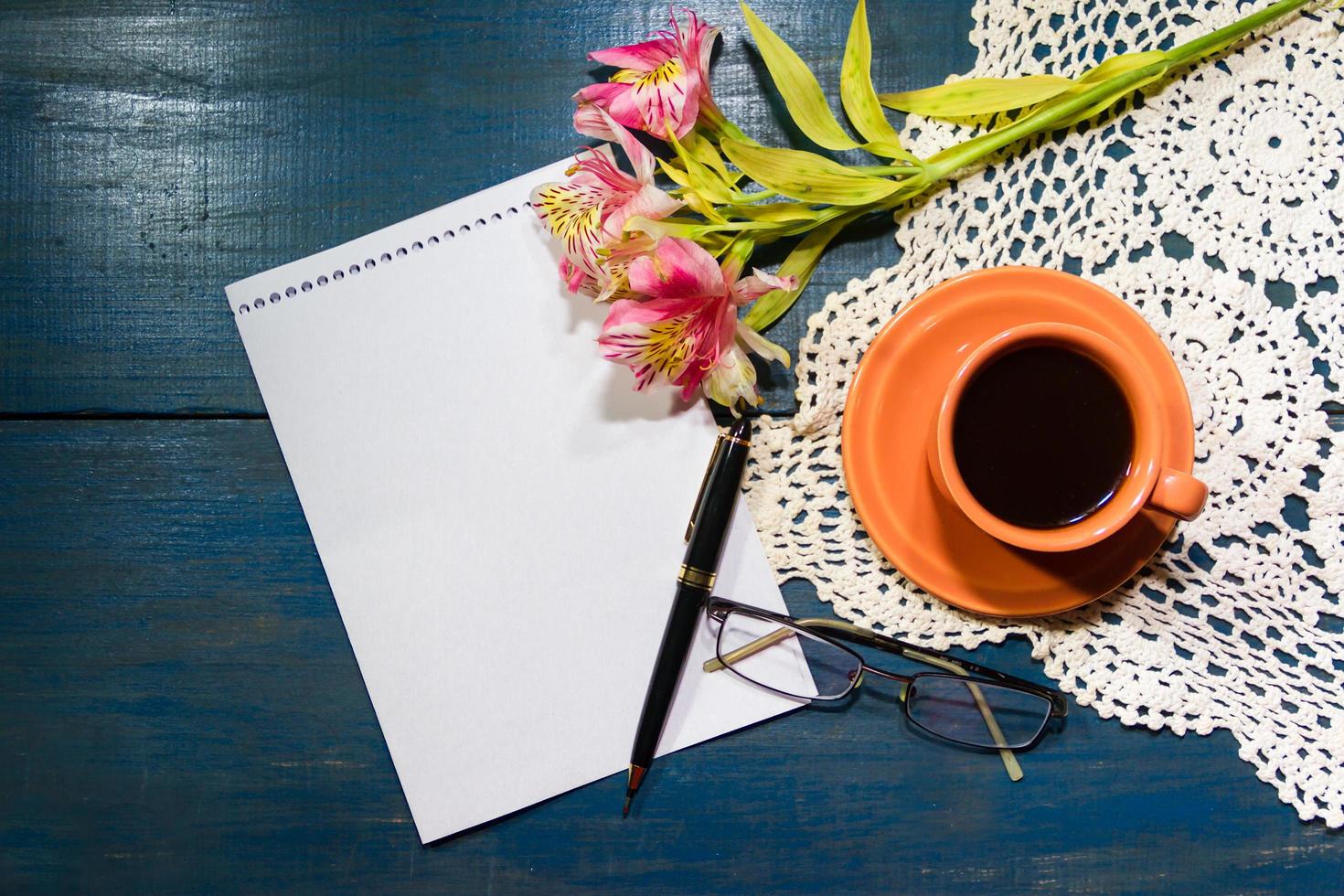 cup of coffee with flowers and note with place for text photo