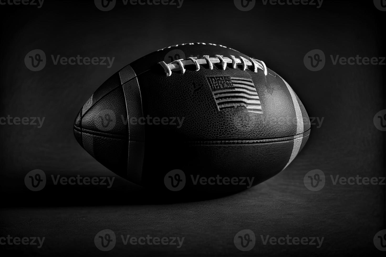 Close up of an American football on dark background. photo