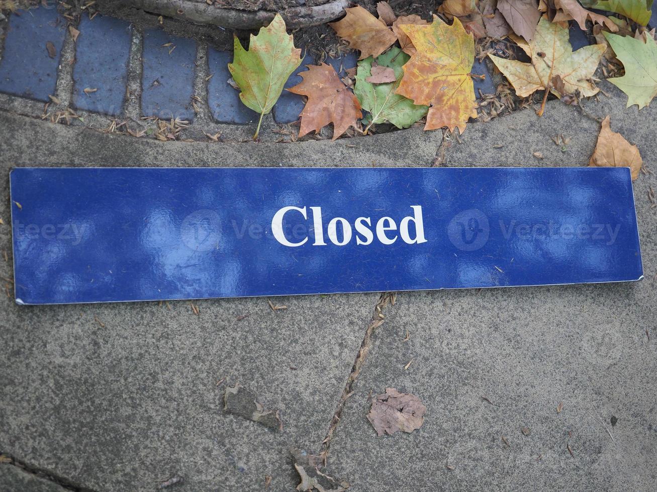 closed sign on the floor photo