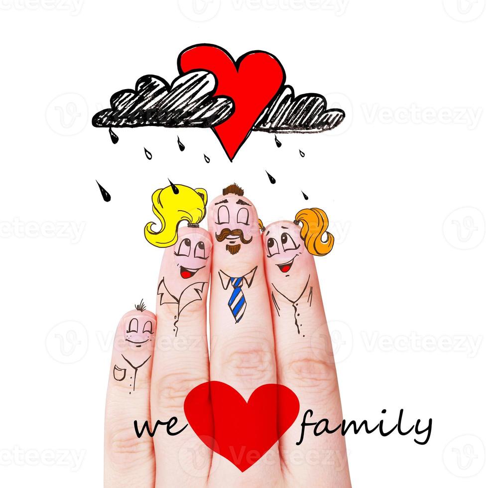 Finger puppets of loving parents with young child hugging and having fun. photo