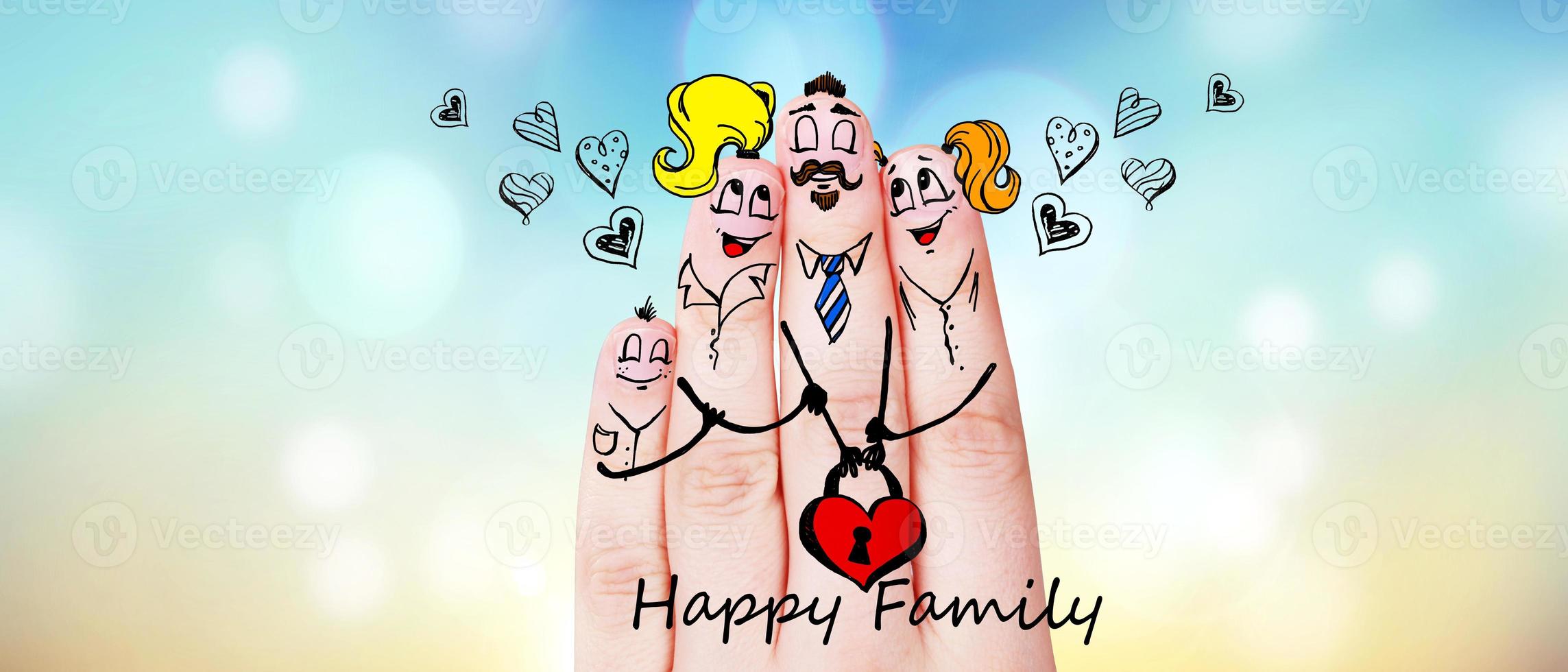 Finger puppets of loving parents with young child hugging and having fun. photo