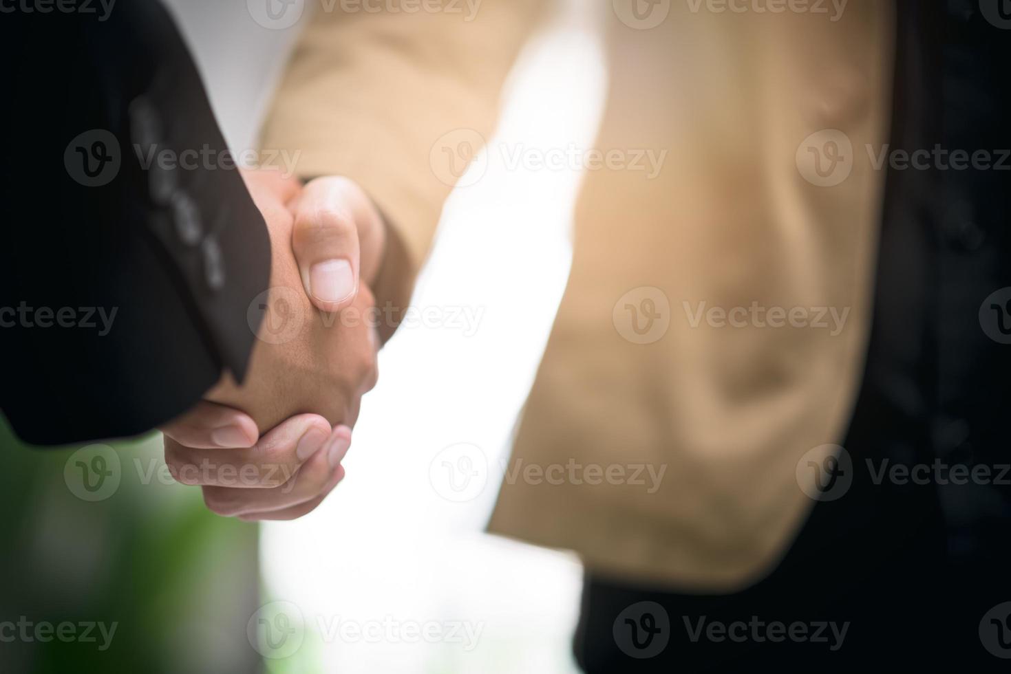 Businessmen shaking hands to indicate a business deal,successful contract management of the company,signing an agreement,business partner,New opportunities for the future of the industry,joint venture photo