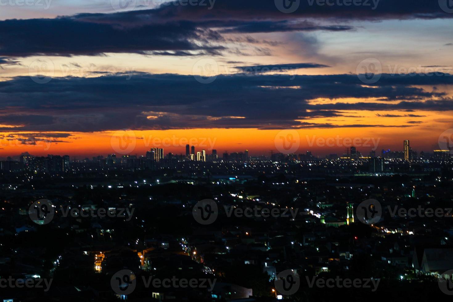 The skyline is a very beautiful sunset sky with an orange color in the sky that is getting dark photo