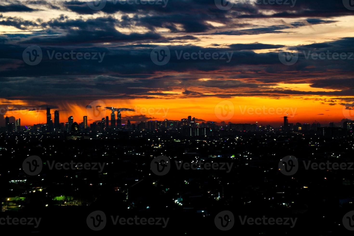 The skyline is a very beautiful sunset sky with an orange color in the sky that is getting dark photo