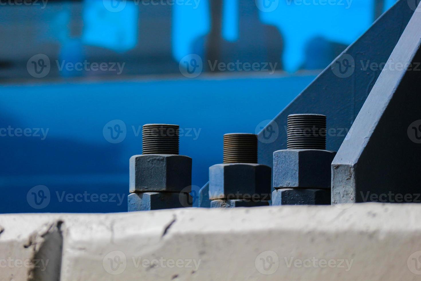 The blue bolts and nuts of the structure with large dimensions are made of high quality steel, high tensile steel. photo