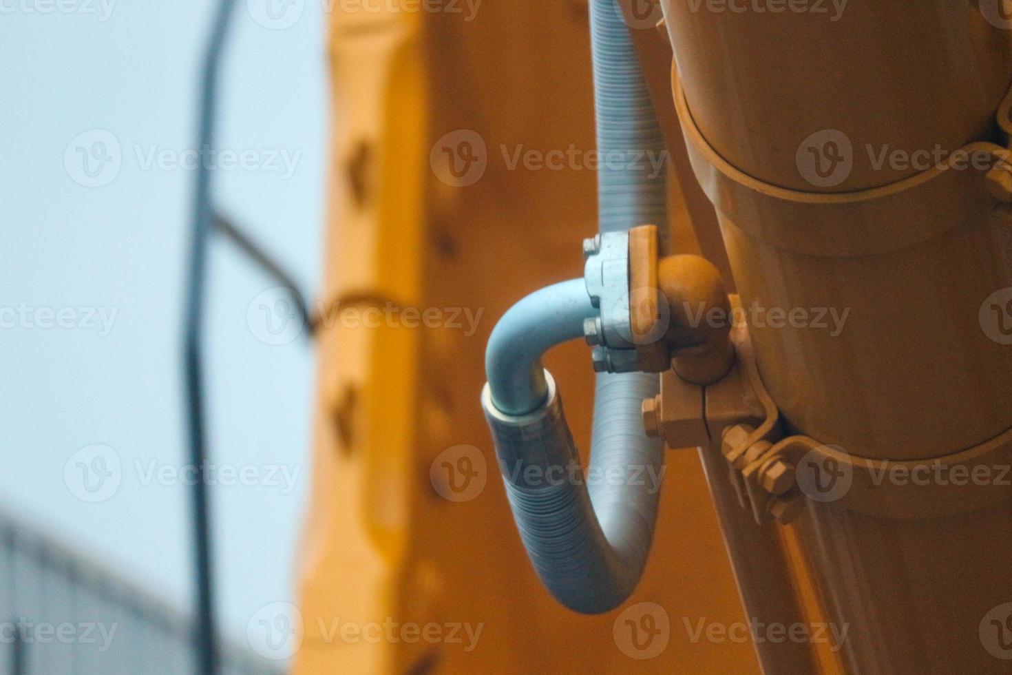 Close up detailed components of the yellow excavator photo