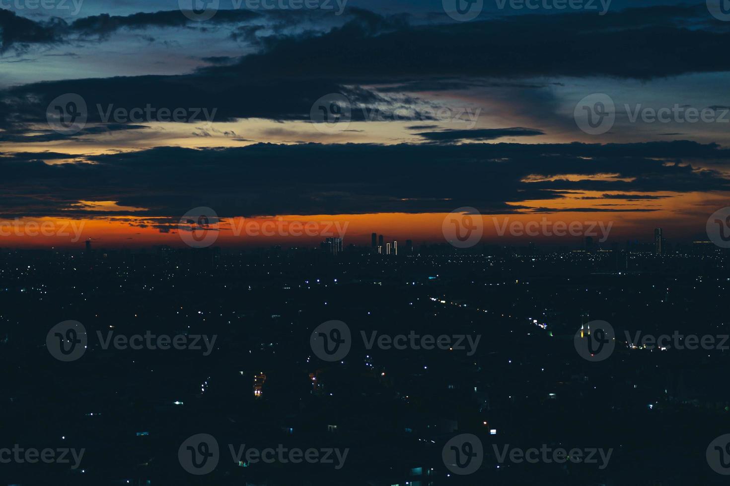 The skyline is a very beautiful sunset sky with an orange color in the sky that is getting dark photo