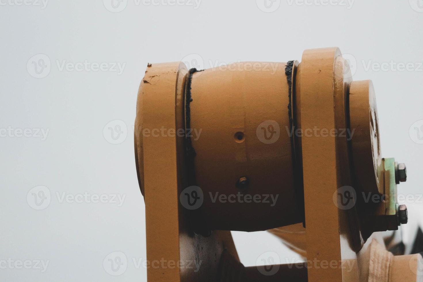 Close up detailed components of the yellow excavator photo