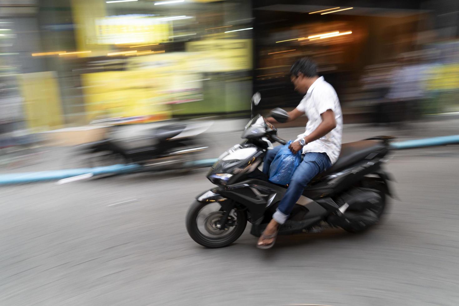 MALE, MALDIVES - FEBRUARY 16 2019 - Traffic in the street before evening pray time photo