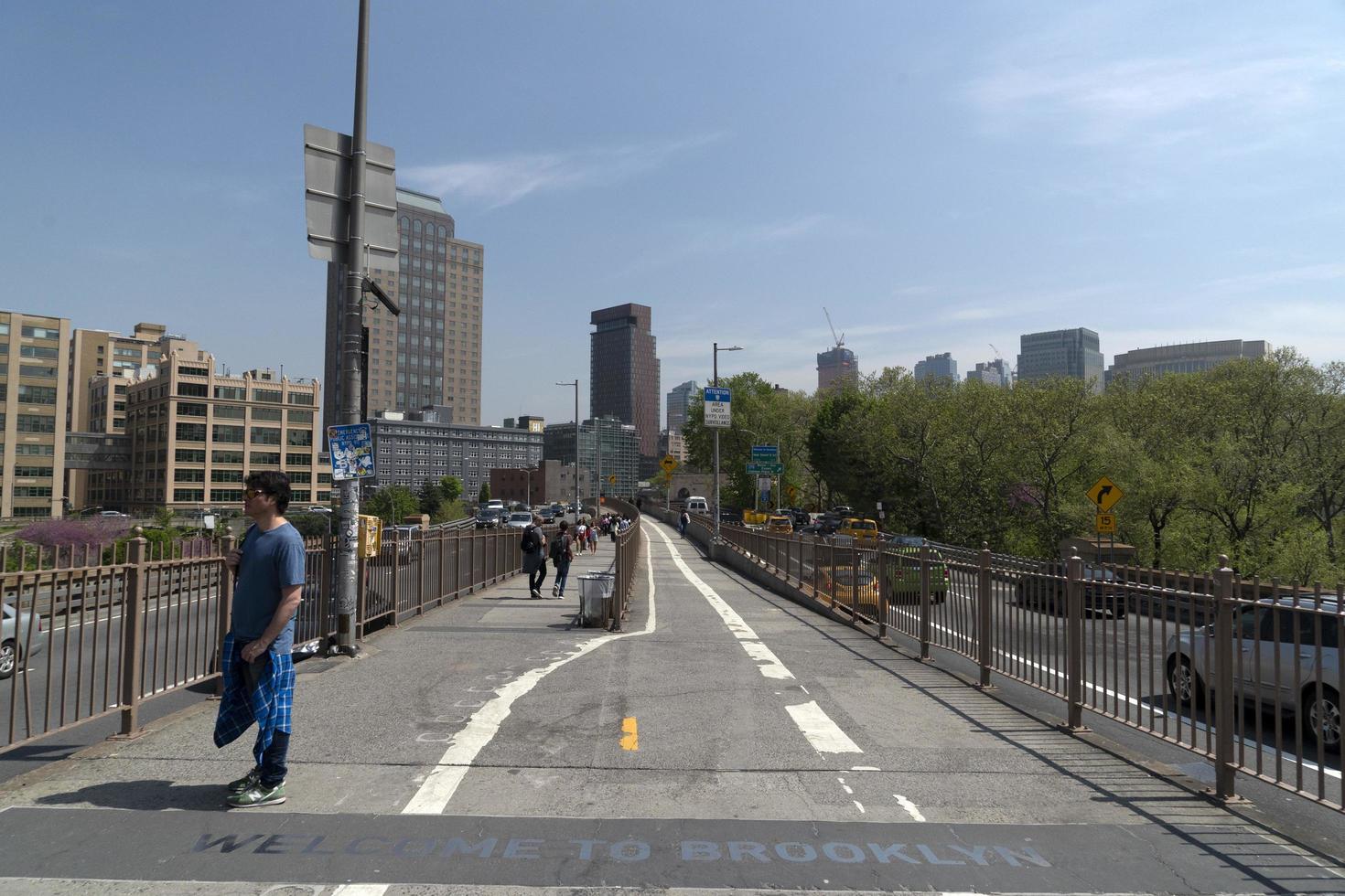 NEW YORK, USA, MAY 2 2019 - Brooklyn bridge full of tourists photo