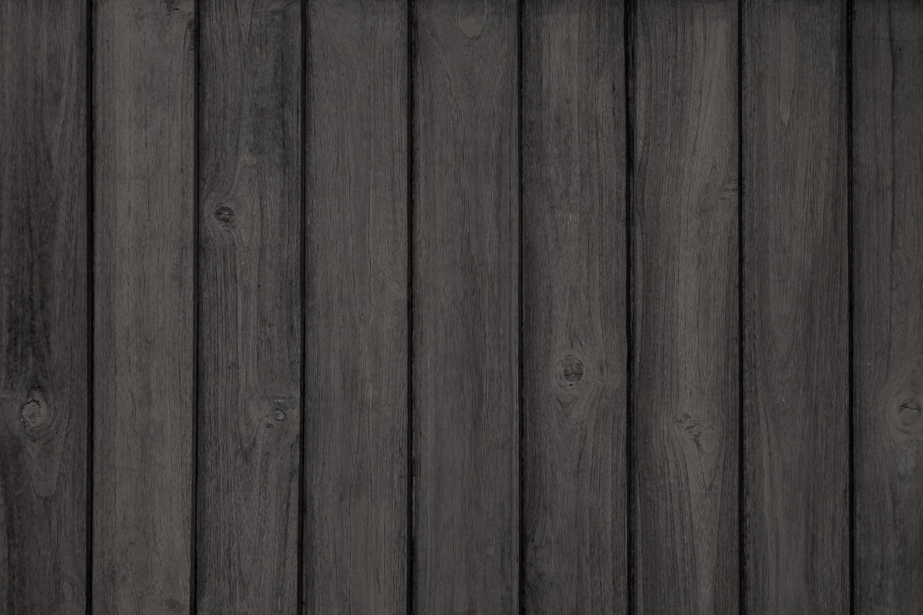 Black rustic natural weathered teak wood textured with dark paint for