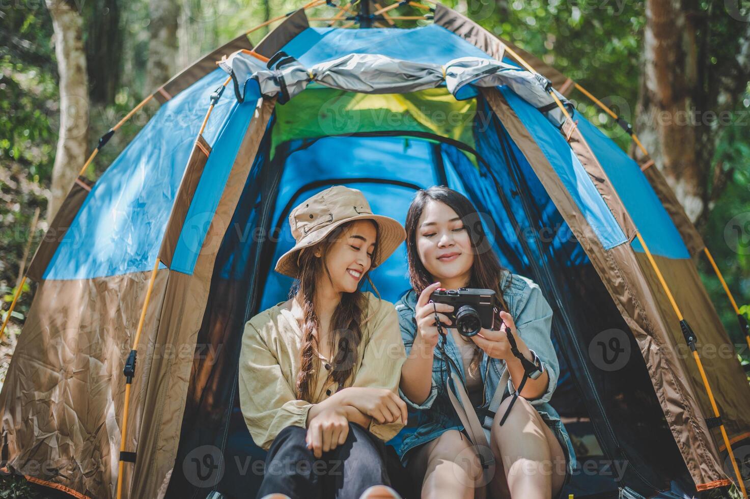 Young woman use camera taking photo and show her friends