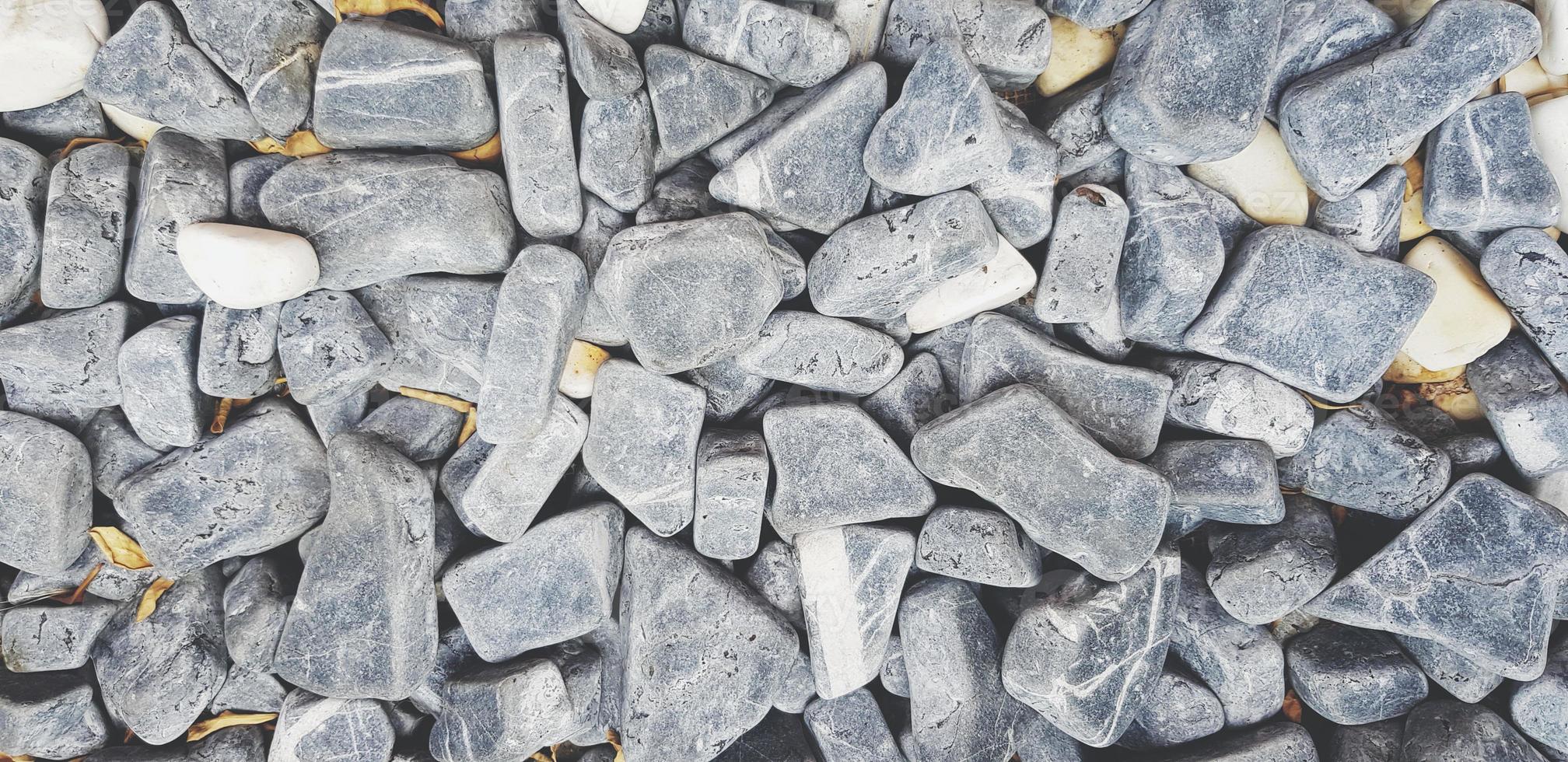 Pattern of gray gravel, rock or small stone for background. Hard material, Art wallpaper and Group of object concept photo