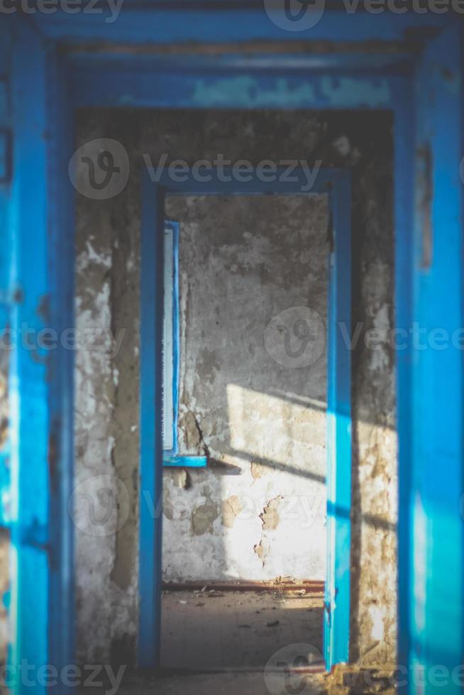 Close up corridor inside abandoned building illuminated by sunlight concept photo