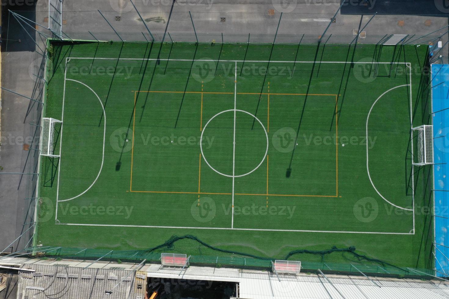 soccer field between houses aerial drone photo