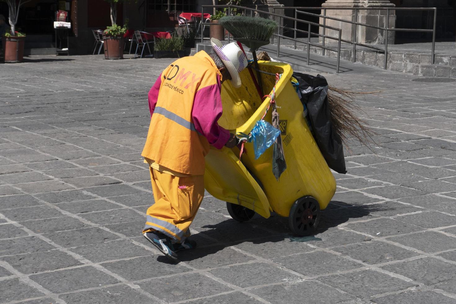 MEXICO CITY, MEXICO - NOVEMBER 5 2017 - Old dustman in Saint Domingo Place photo