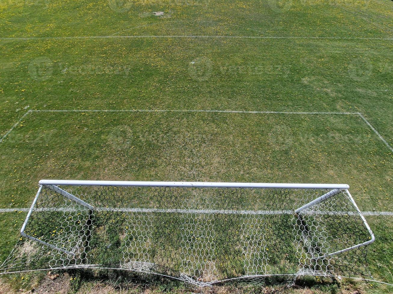 country soccer field green grass with yellow flowers photo
