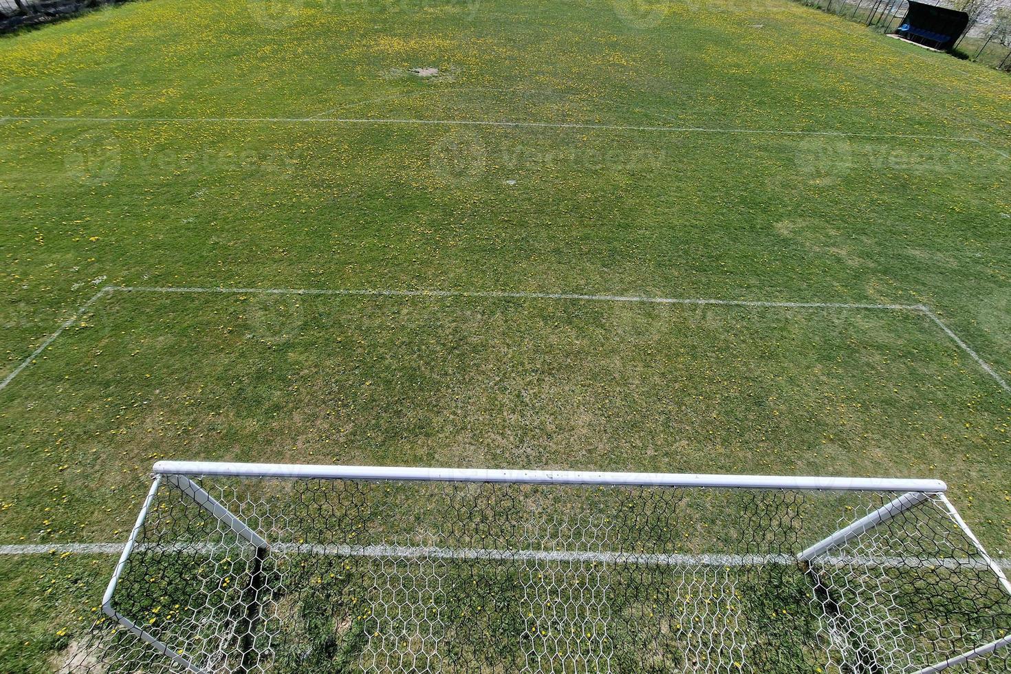 country soccer field with flowers photo