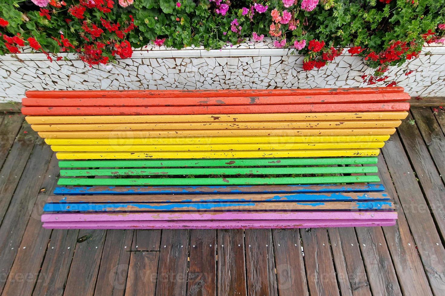 Rainbow flag bench after the rain in Valencia photo