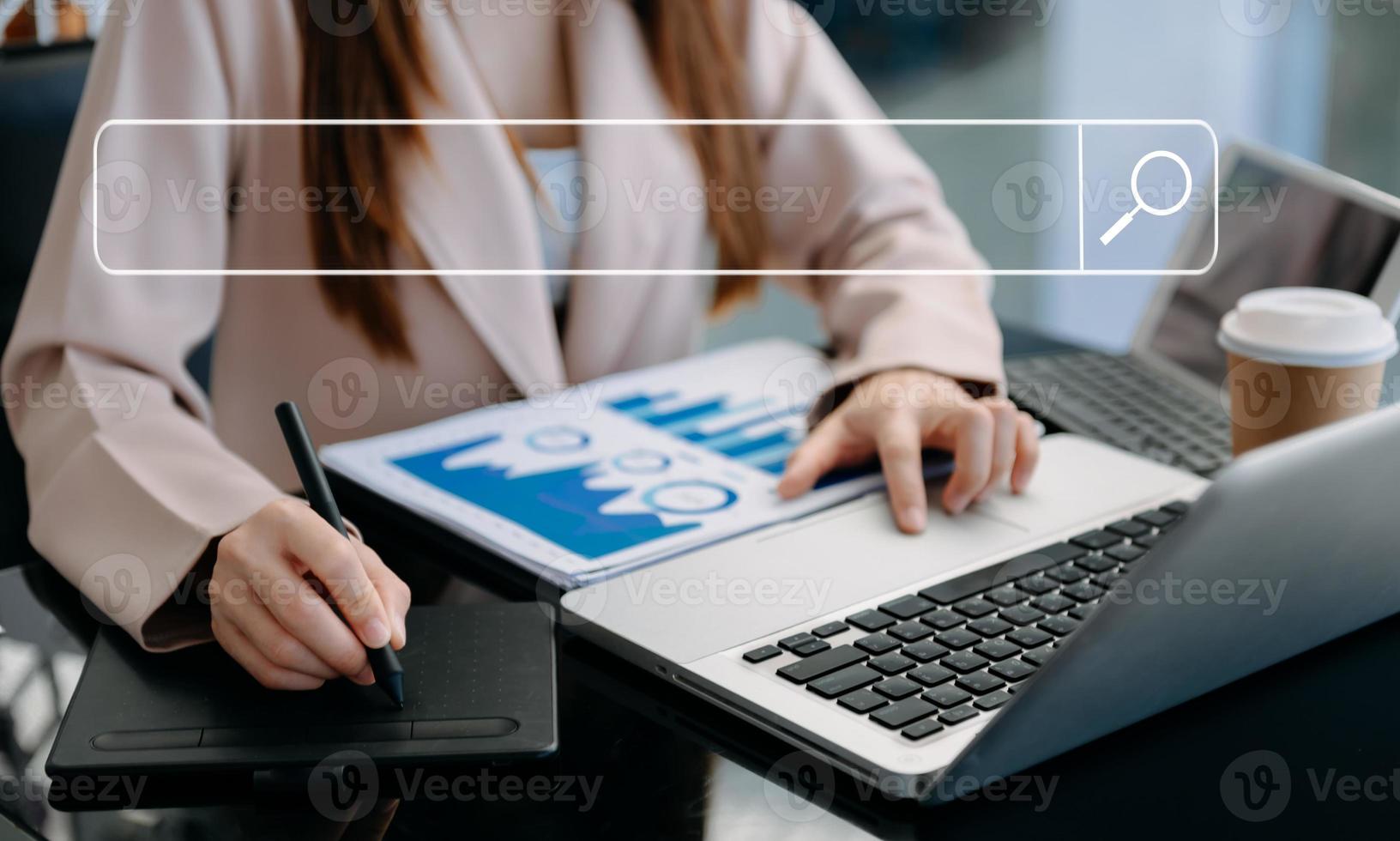 Searching Browsing Internet Data Information Networking Concept with blank search bar.man working with mobile phone and laptop computer VR icon in office photo