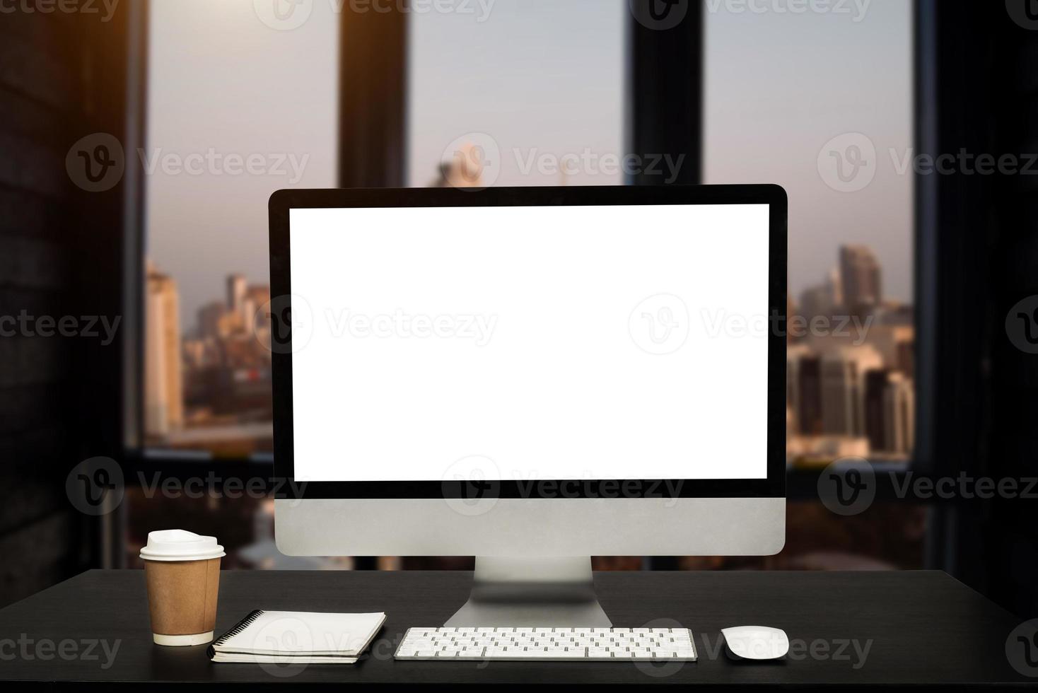 workspace with computer, laptop, office supplies, and coffee cup, smartphone, and tablet at office. desk work concept. photo