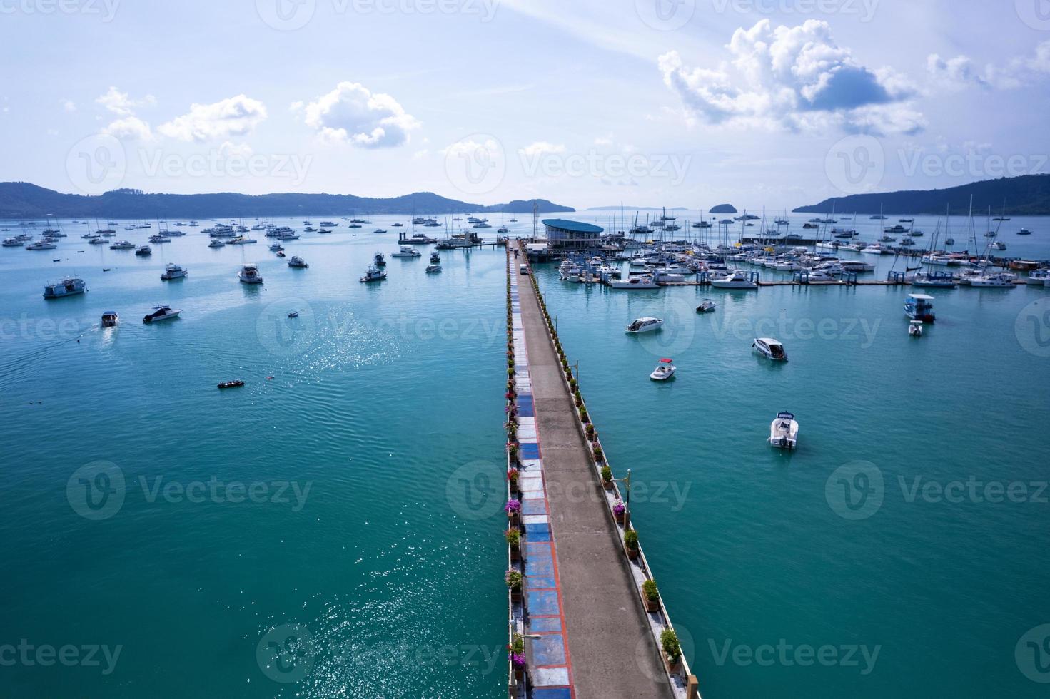 Aerial View Top down Drone shot of Yacht and sailboat parking in marina Transportation and travel background Beautiful sea in summer season photo