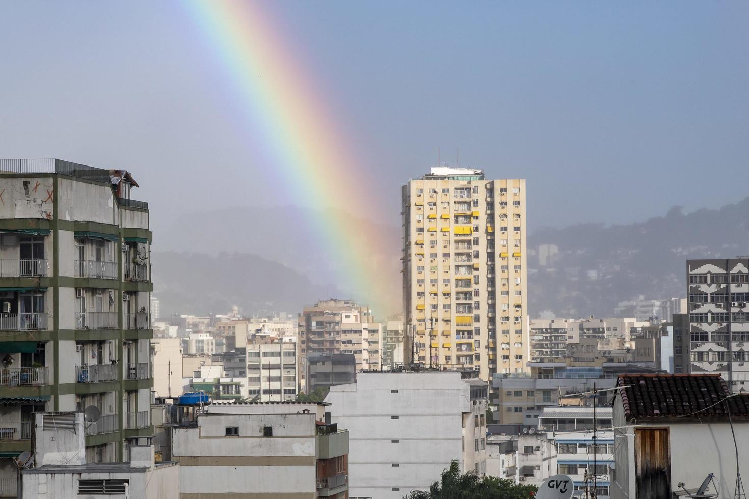 Rio, Brazil - January 03, 2023, rainbow scene in urban area with building photo