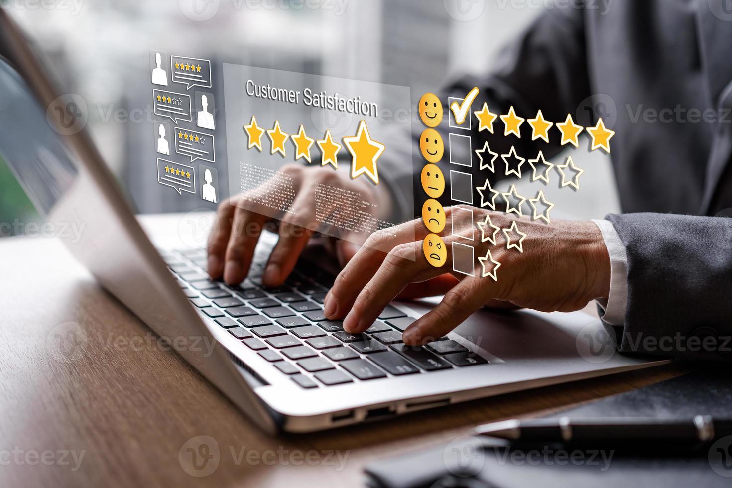 Businessman using laptop to give a five-star satisfaction rating of the poll, survey or questionnaire for user experience, Customer service evaluation concept photo