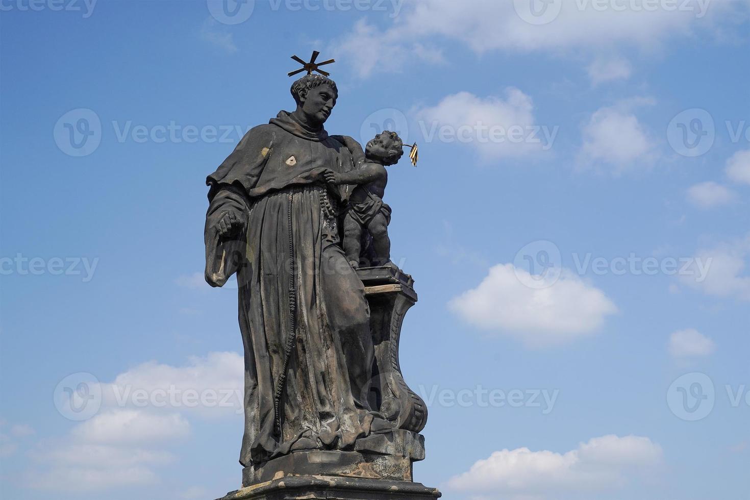 Prague charles bridge detail of statue photo