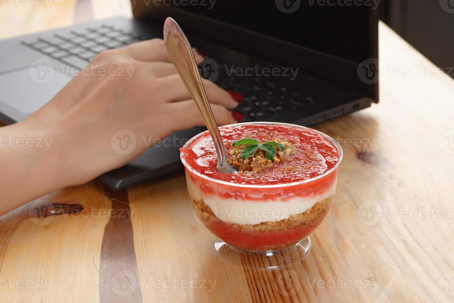 Light berry dessert Trifle red velvet with strawberries in the home office photo