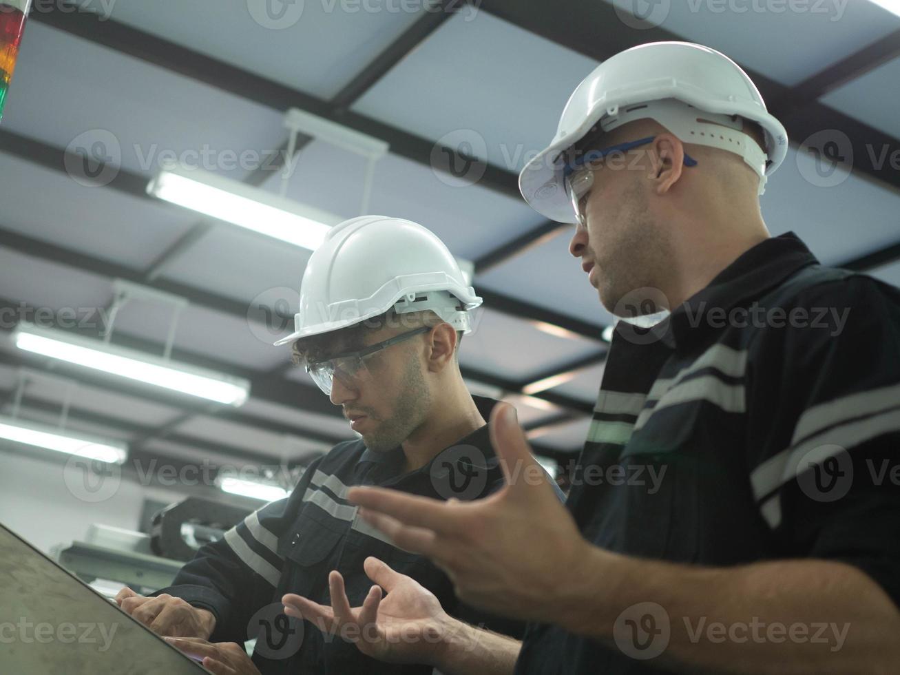 Engineer male person talk speak discussion conversation electronic motor gear industry factory maintenance technology manufacturing businessman manager company work job occupation safety warehouse photo