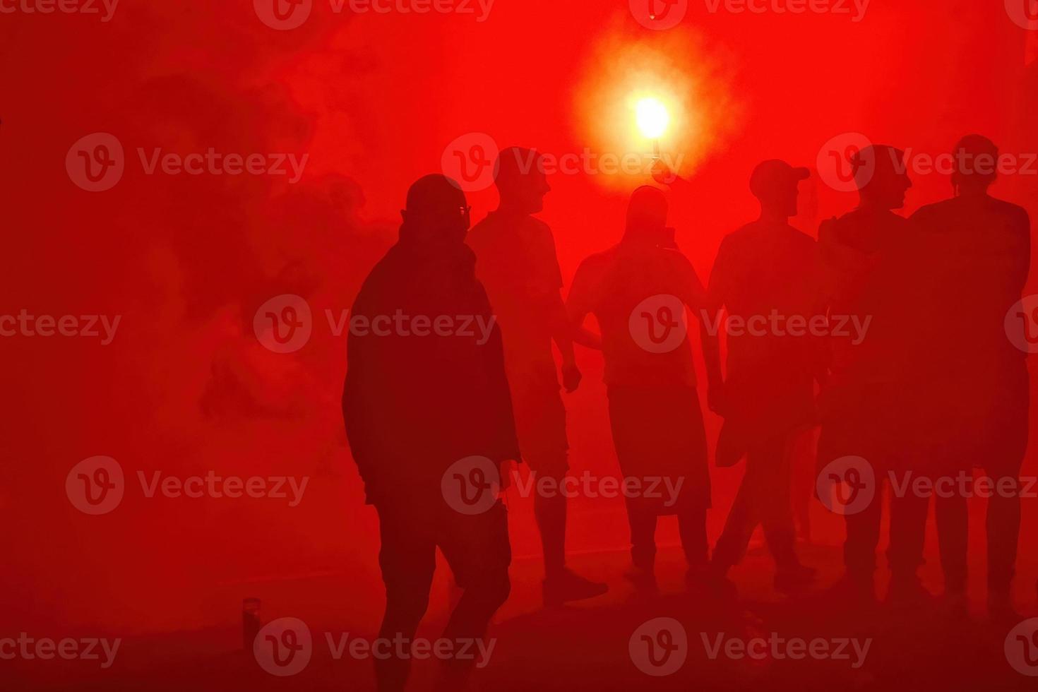 red smoke black people silhouette protest demonstration photo