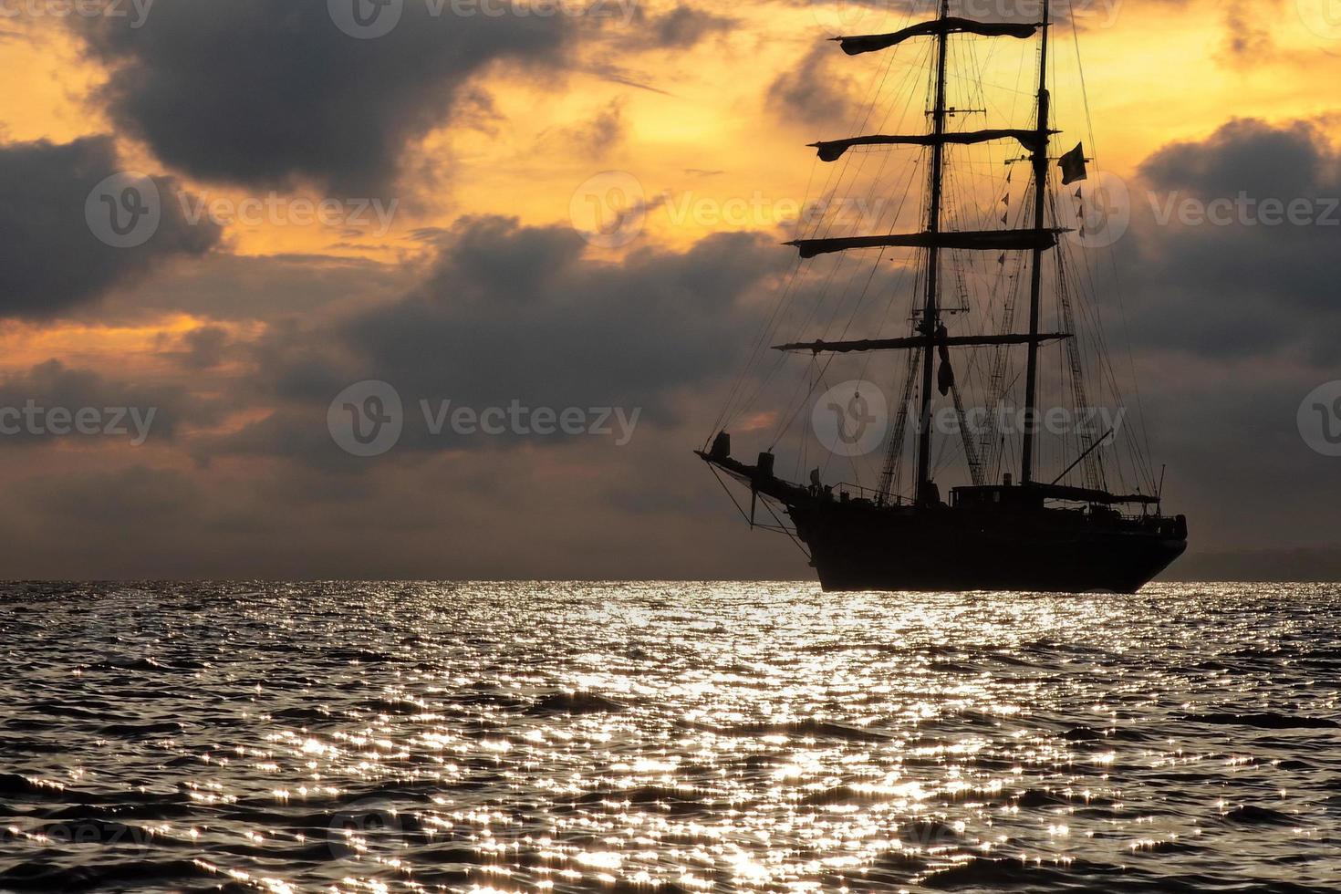 old vessel silhouette at sunset photo