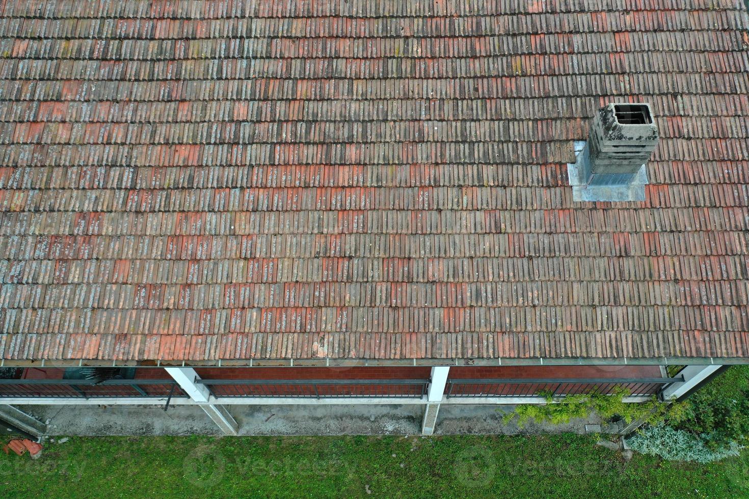 italiy tile roof chimney detail drone view photo