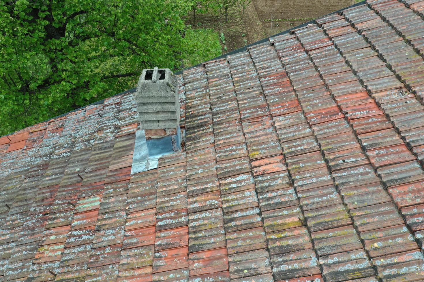 italiy tile roof chimney detail drone view photo