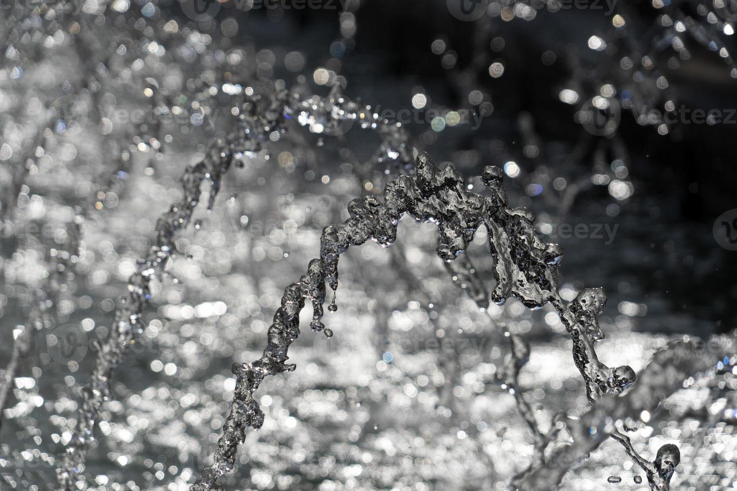 detalle de agua de salpicadura de fuente de cerca foto